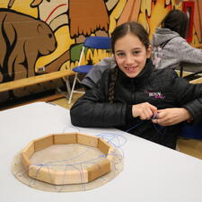 Female grade 5 student poses with their drum